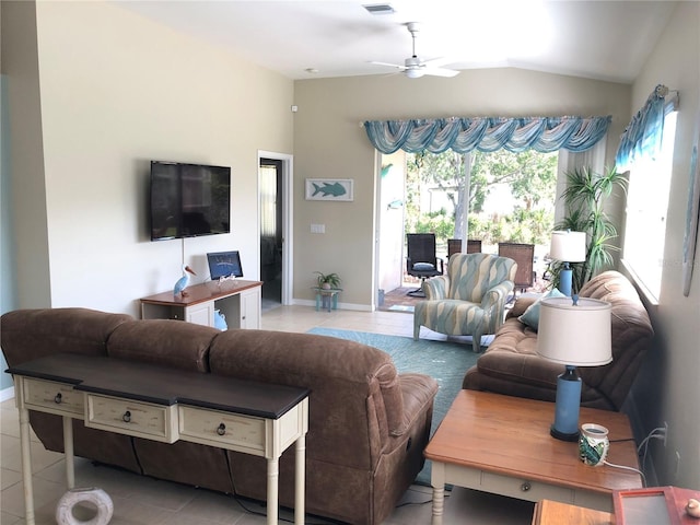 living room with ceiling fan, lofted ceiling, and light tile patterned flooring