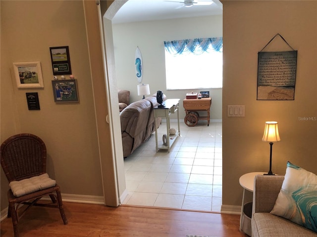 hallway with light hardwood / wood-style floors