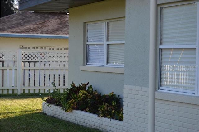 view of property exterior with a yard