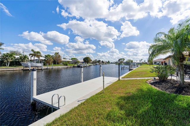 dock area featuring a yard and a water view