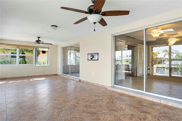 spare room with ceiling fan