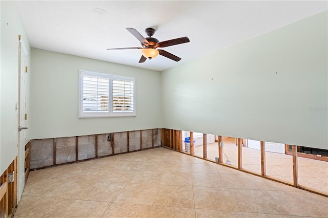 spare room with ceiling fan