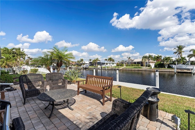 view of patio / terrace featuring a boat dock and a water view