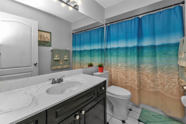 bathroom featuring a shower with curtain, vanity, and toilet