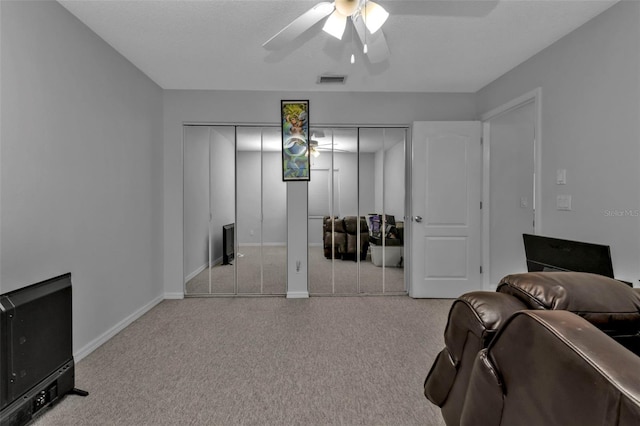 interior space featuring ceiling fan