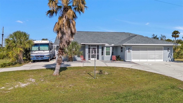 ranch-style home with a front yard and a garage