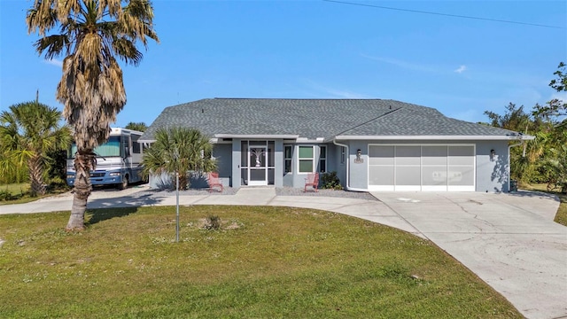 single story home featuring a front lawn and a garage