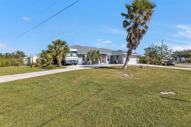5198 White Ave, Port Charlotte, FL 33981 - ranch-style home featuring concrete driveway, a garage, and a front lawn