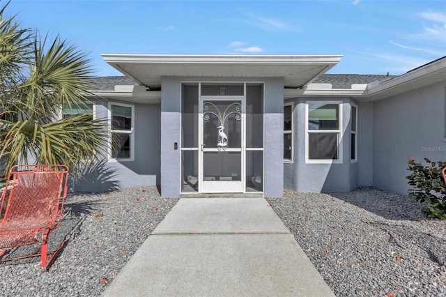 5198 White Ave, Port Charlotte, FL 33981 - doorway to property featuring stucco siding