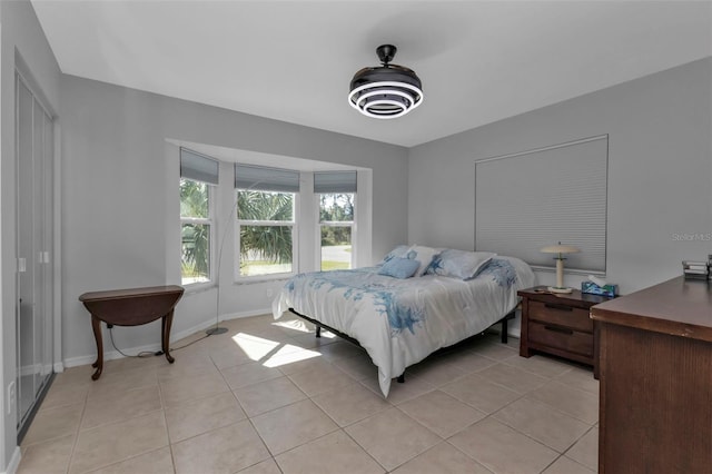 5198 White Ave, Port Charlotte, FL 33981 - bedroom featuring light tile patterned flooring and baseboards