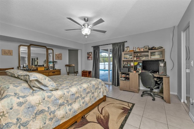 5198 White Ave, Port Charlotte, FL 33981 - bedroom with access to exterior, light tile patterned flooring, a desk, baseboards, and a textured ceiling