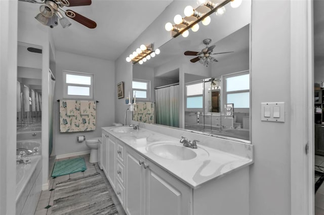 5198 White Ave, Port Charlotte, FL 33981 - bathroom featuring a ceiling fan, toilet, baseboards, a bathtub, and double vanity