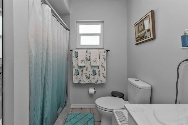 5198 White Ave, Port Charlotte, FL 33981 - full bathroom featuring toilet, tile patterned flooring, a shower with shower curtain, and vanity