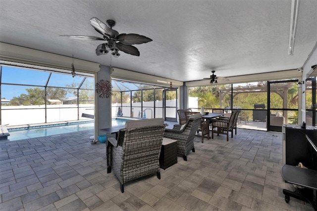 5198 White Ave, Port Charlotte, FL 33981 - sunroom / solarium featuring a ceiling fan, a swimming pool, and outdoor dining area