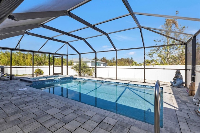 5198 White Ave, Port Charlotte, FL 33981 - view of pool featuring a patio area, a pool with connected hot tub, glass enclosure, and a fenced backyard
