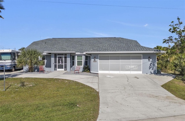 5198 White Ave, Port Charlotte, FL 33981 - single story home with roof with shingles, stucco siding, a garage, a front yard, and concrete driveway