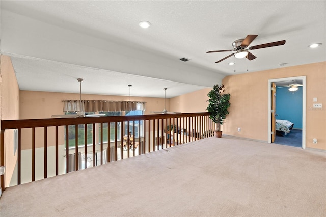 spare room with carpet flooring and a textured ceiling