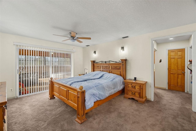 bedroom featuring carpet flooring, access to exterior, ceiling fan, and a textured ceiling