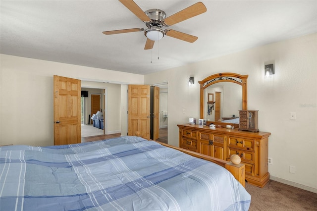 bedroom featuring ceiling fan and light colored carpet