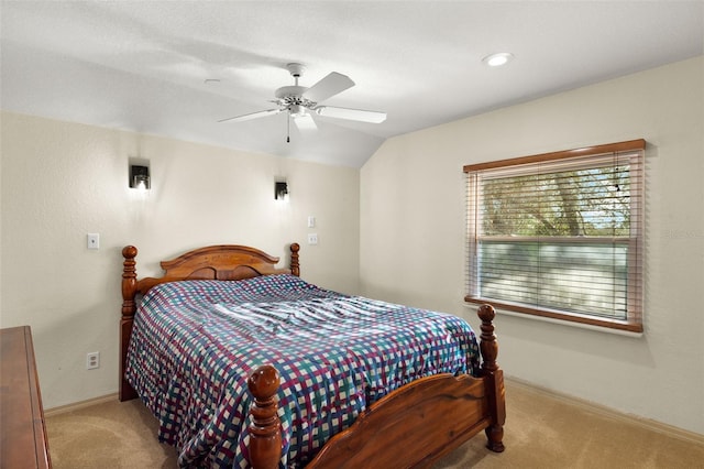 carpeted bedroom with ceiling fan and lofted ceiling