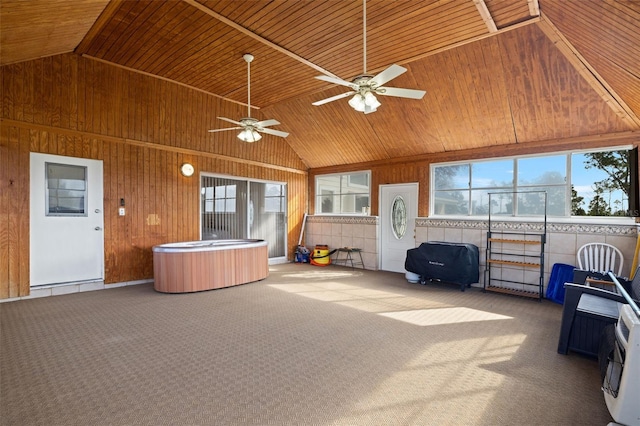 view of patio / terrace featuring ceiling fan and a hot tub