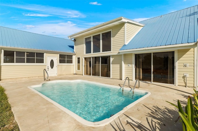 back of house with a patio area