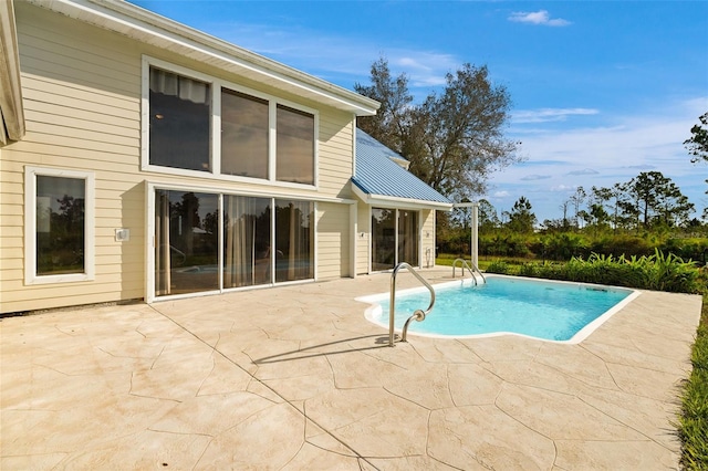 view of swimming pool with a patio