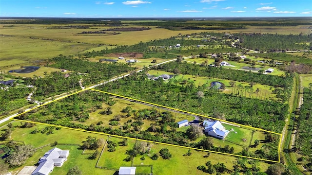 birds eye view of property with a rural view