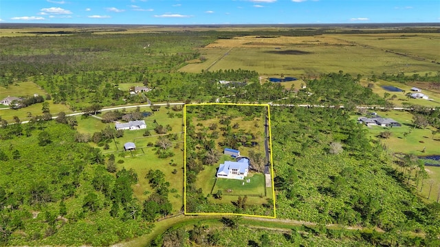 birds eye view of property with a rural view