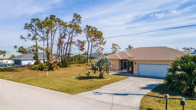 view of front of home featuring a garage and a front yard