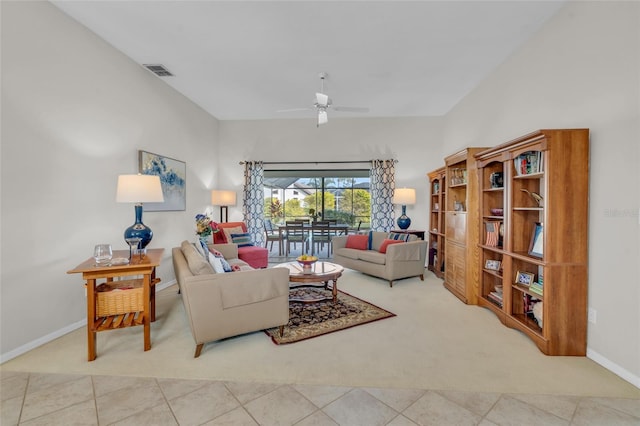 living room featuring carpet flooring and ceiling fan