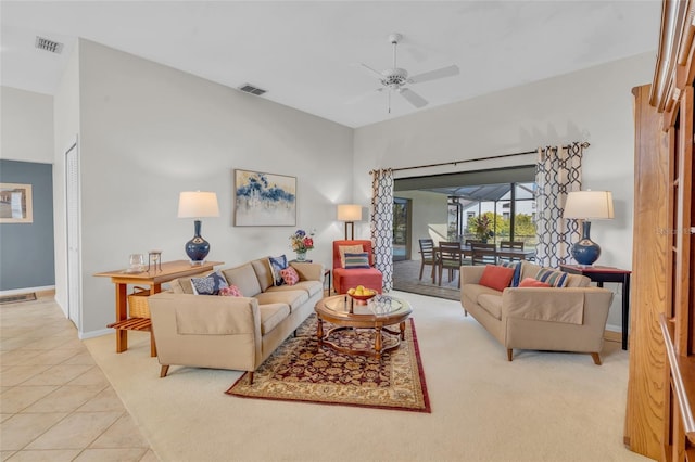 tiled living room featuring ceiling fan