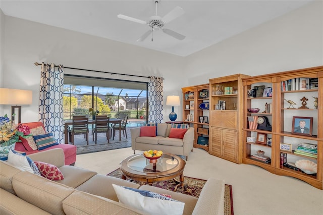 living room featuring light carpet and ceiling fan