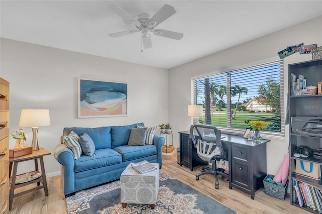 home office featuring ceiling fan and light hardwood / wood-style floors