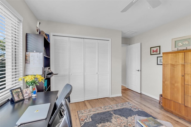 office with ceiling fan and light hardwood / wood-style floors