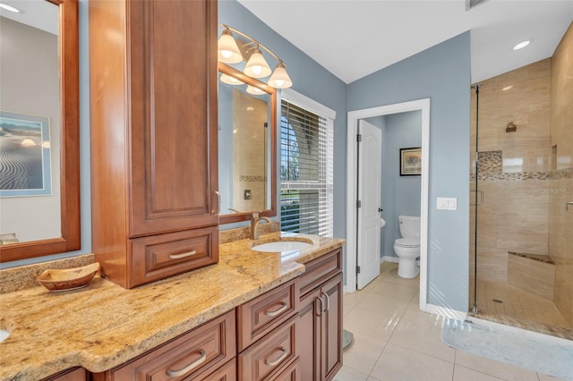 bathroom featuring tile patterned floors, walk in shower, vanity, vaulted ceiling, and toilet