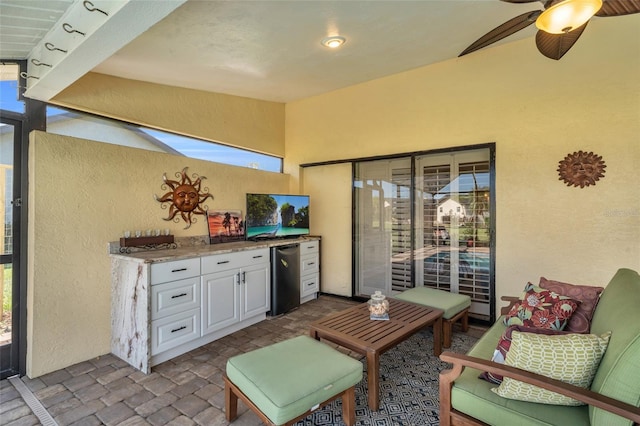 view of patio featuring ceiling fan and exterior kitchen