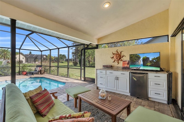 exterior space featuring an outdoor kitchen, a lanai, and a patio