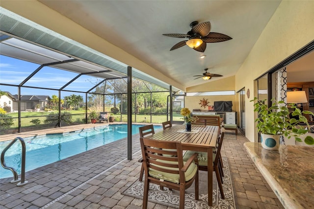 view of swimming pool featuring glass enclosure and a patio