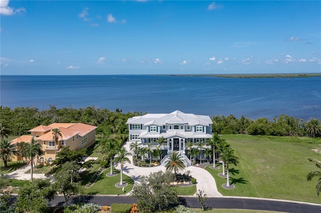 birds eye view of property with a water view