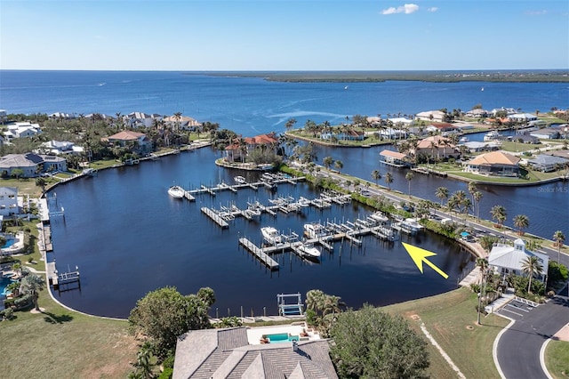 birds eye view of property featuring a water view