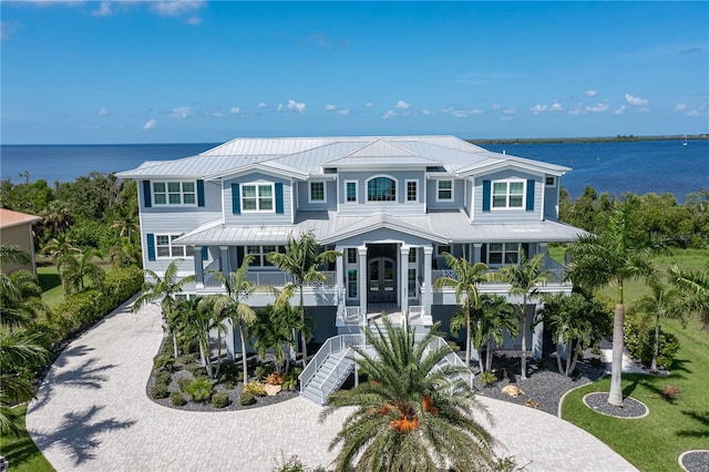 view of front of home featuring covered porch and a water view