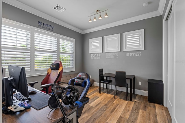 home office featuring wood-type flooring and crown molding