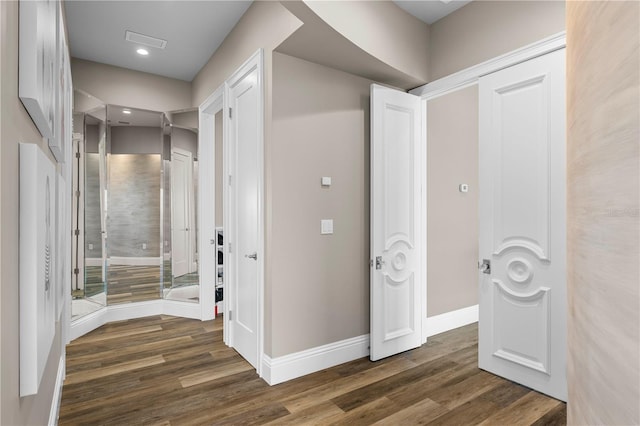 hallway featuring dark hardwood / wood-style floors