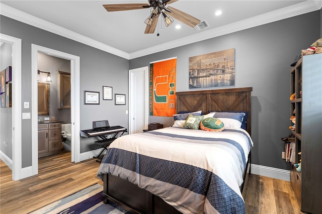 bedroom with wood-type flooring, connected bathroom, ceiling fan, and crown molding