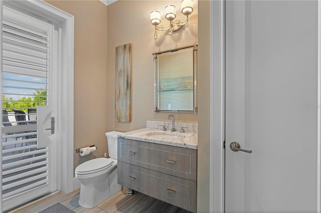 bathroom featuring hardwood / wood-style floors, vanity, and toilet