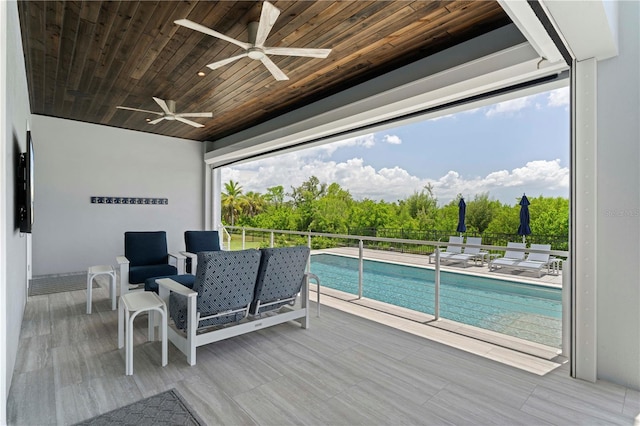 wooden terrace with a fenced in pool