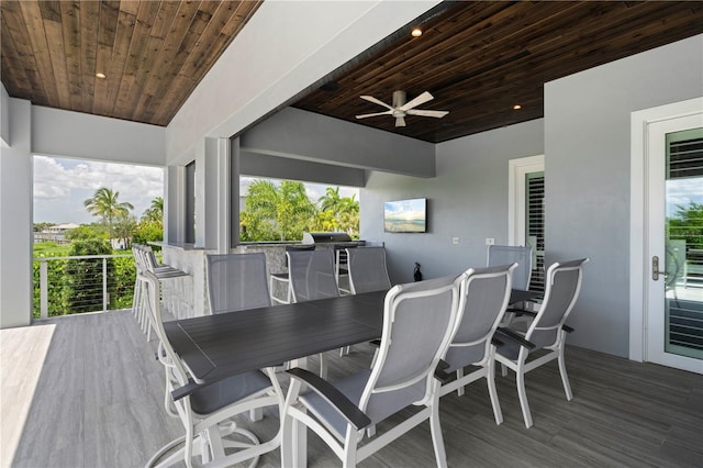 wooden terrace featuring ceiling fan