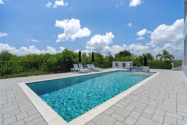 view of swimming pool featuring a patio