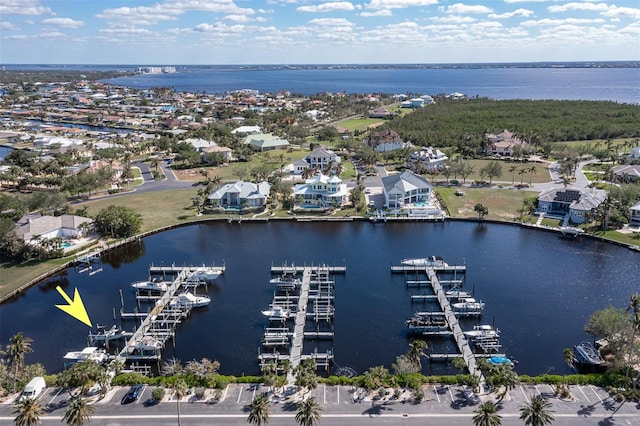 birds eye view of property featuring a water view